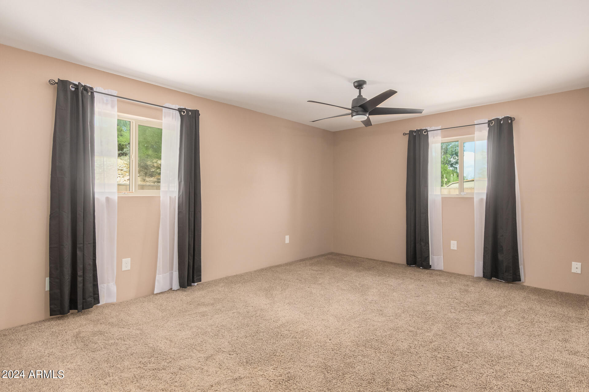 4980 North Hillcrest Drive Tucson, AZ 85704 - Photo 20 of 33 a view of a livingroom with a ceiling fan and window