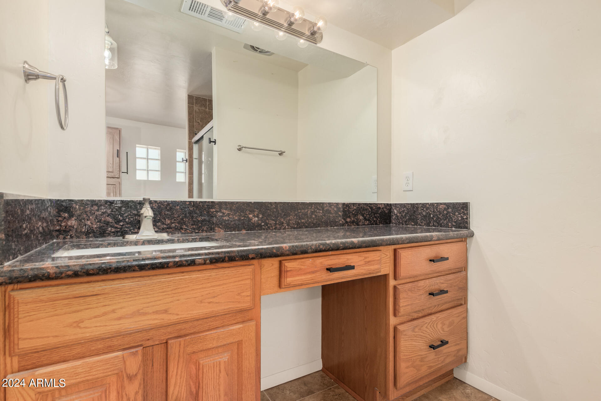 4980 North Hillcrest Drive Tucson, AZ 85704 - Photo 22 of 33 a sink with granite countertop a sink and cabinets