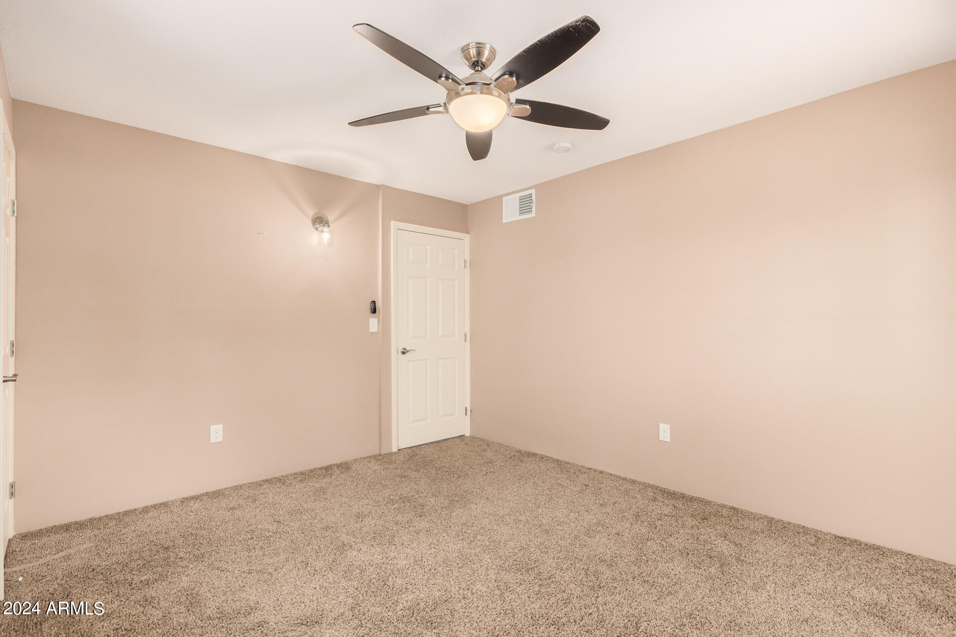 4980 North Hillcrest Drive Tucson, AZ 85704 - Photo 23 of 33 an empty room with closet and ceiling fan