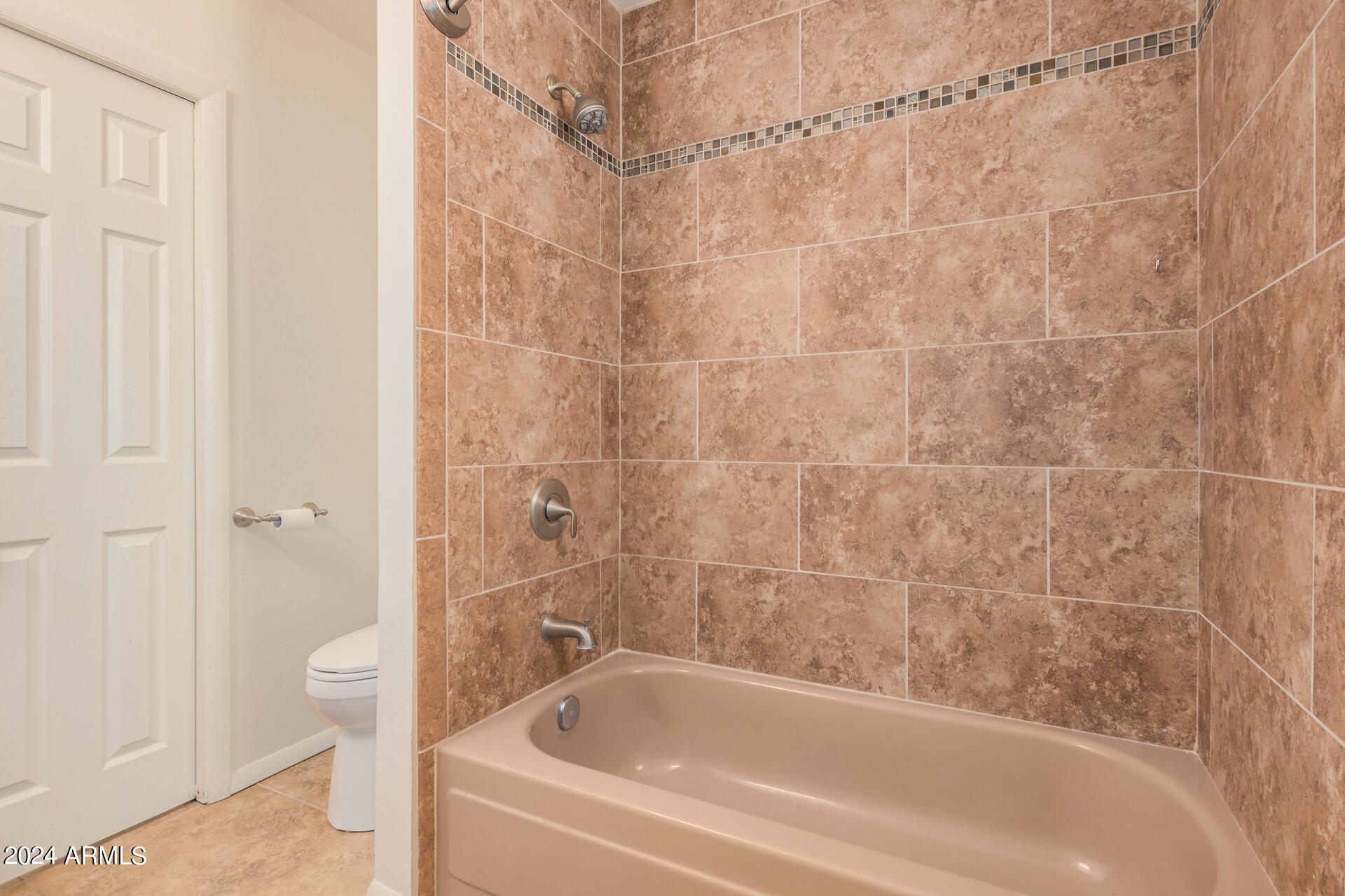 4980 North Hillcrest Drive Tucson, AZ 85704 - Photo 27 of 33 a bathroom with a bathtub and a toilet