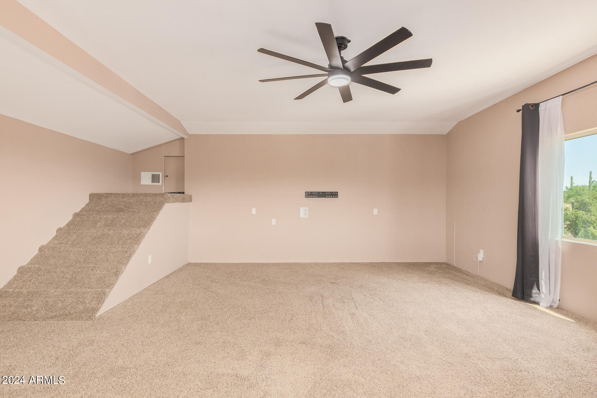 4980 North Hillcrest Drive Tucson, AZ 85704 - Photo 29 of 33 a view of a big room with a ceiling fan and windows
