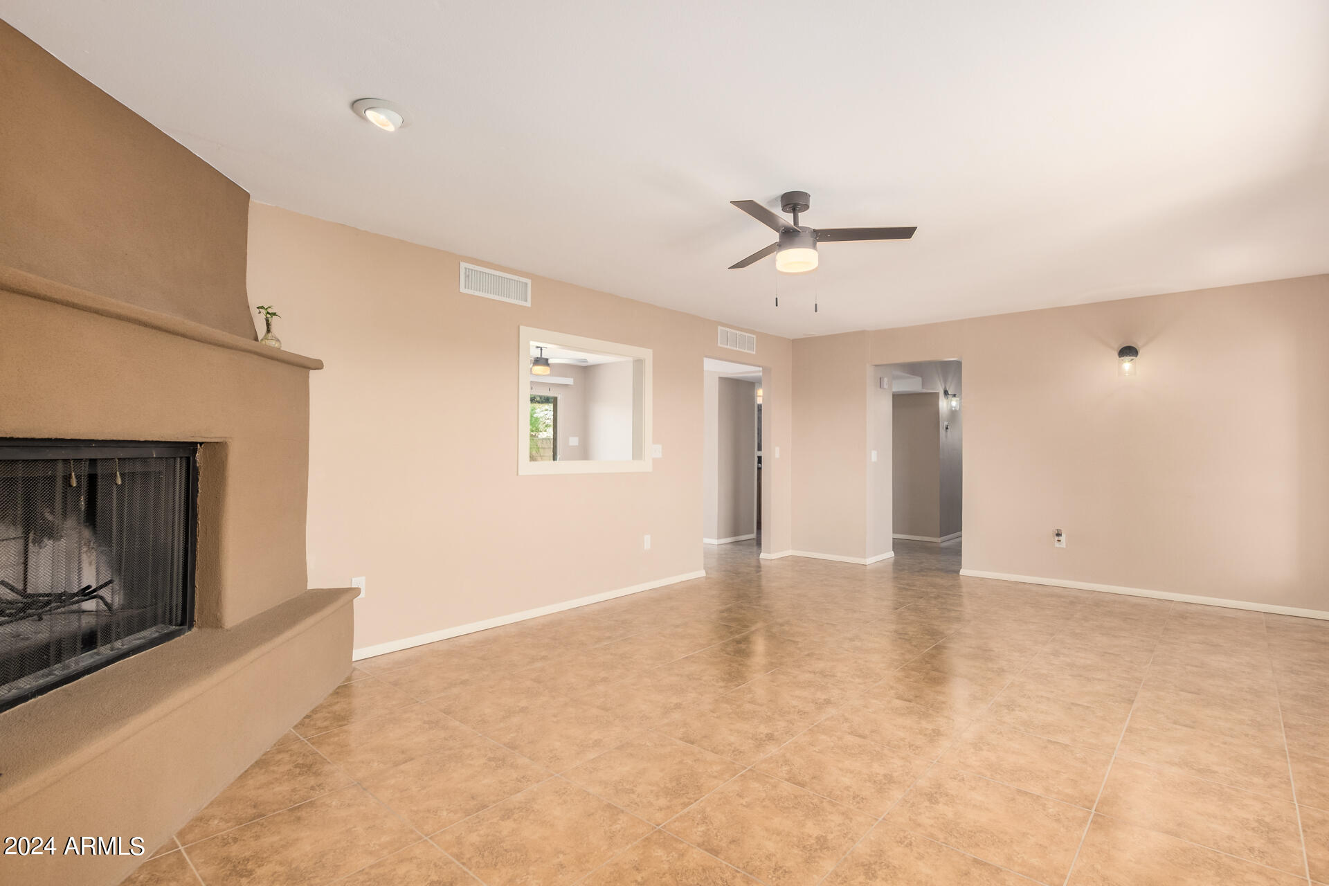 4980 North Hillcrest Drive Tucson, AZ 85704 - Photo 9 of 33 a view of an empty room with a fireplace
