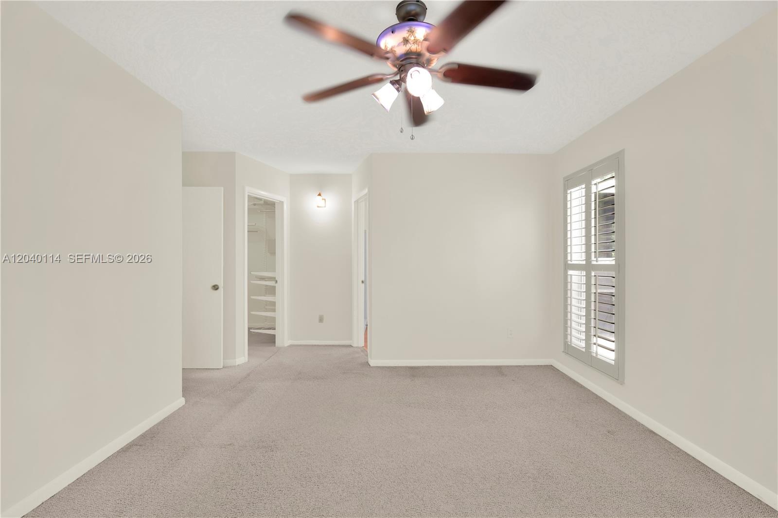 10435 Southwest 96th Street Miami, FL 33176 - Photo 23 of 44 Another view of the primary bedroom with plantation shutters