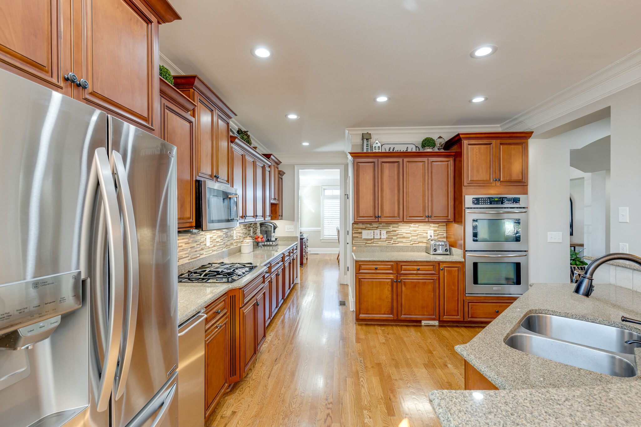 3207 Appian Way Spring Hill, TN 37174 - Photo 14 of 50 a kitchen with stainless steel appliances granite countertop a refrigerator a sink and a stove