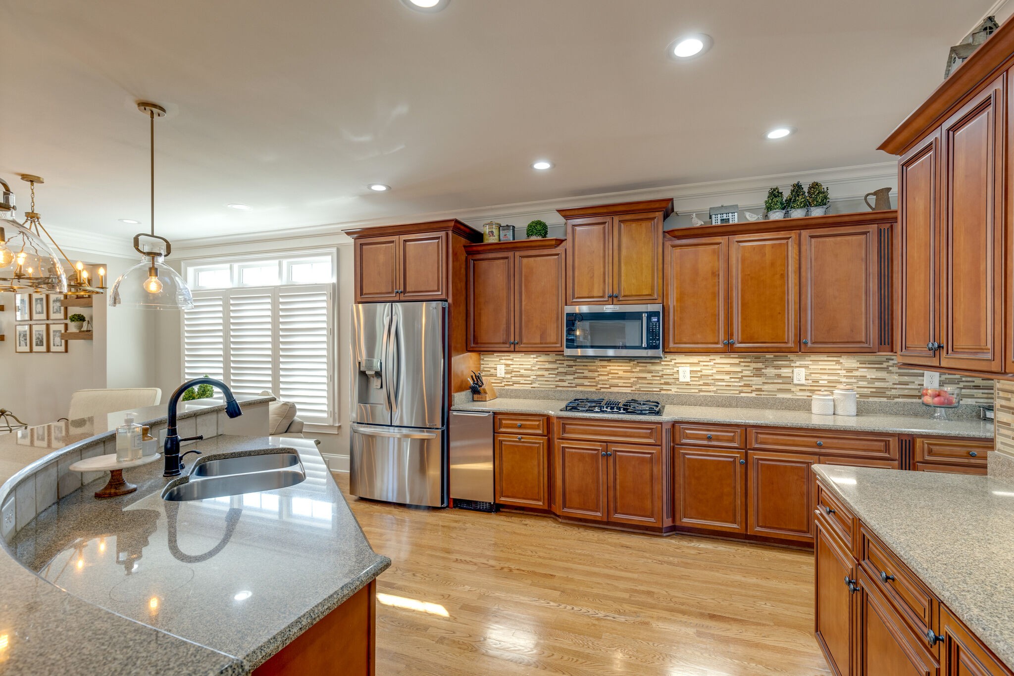 3207 Appian Way Spring Hill, TN 37174 - Photo 15 of 50 a kitchen with stainless steel appliances granite countertop a sink refrigerator and cabinets