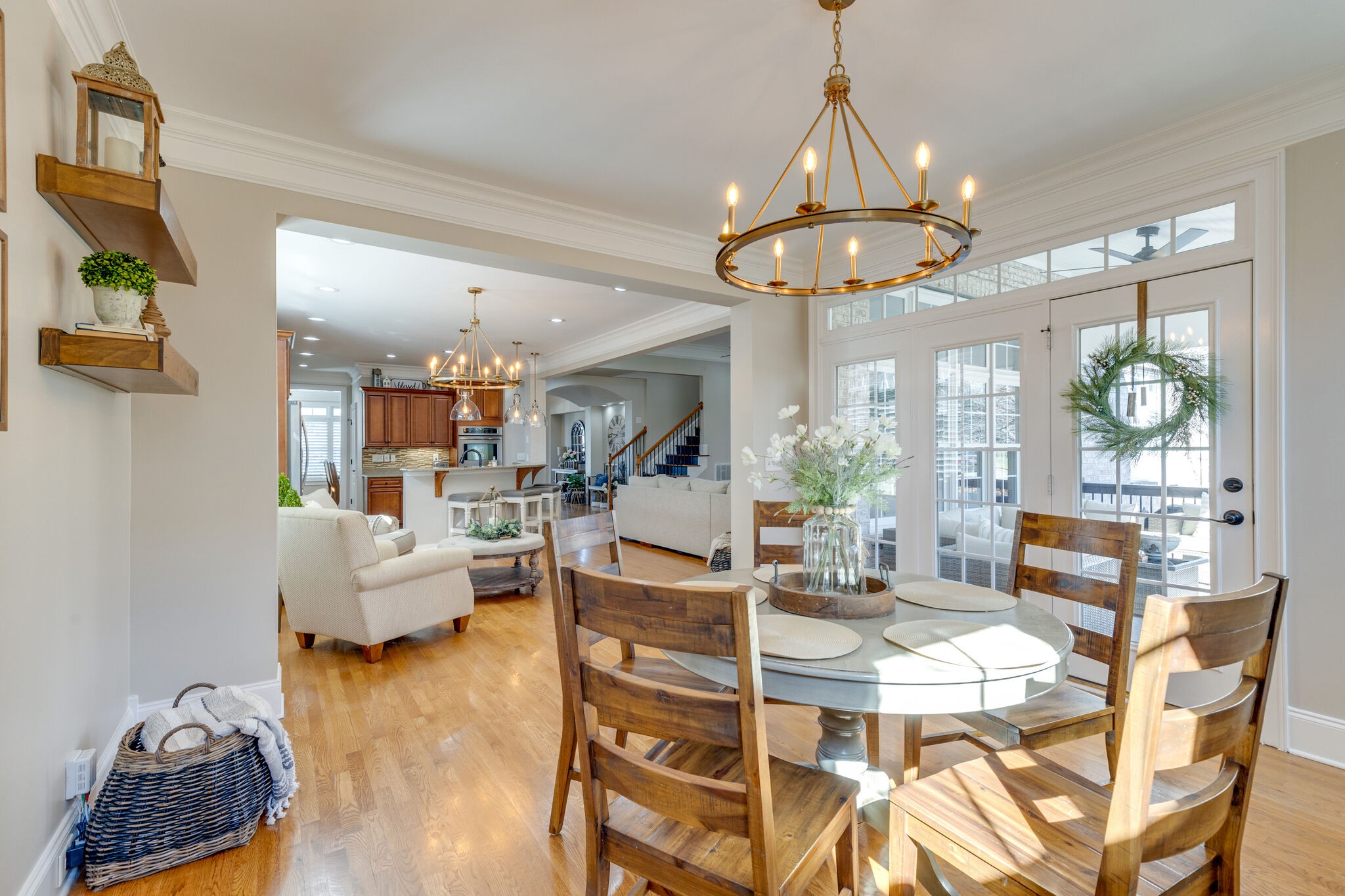 3207 Appian Way Spring Hill, TN 37174 - Photo 23 of 50 a view of a dining room with furniture a chandelier and wooden floor