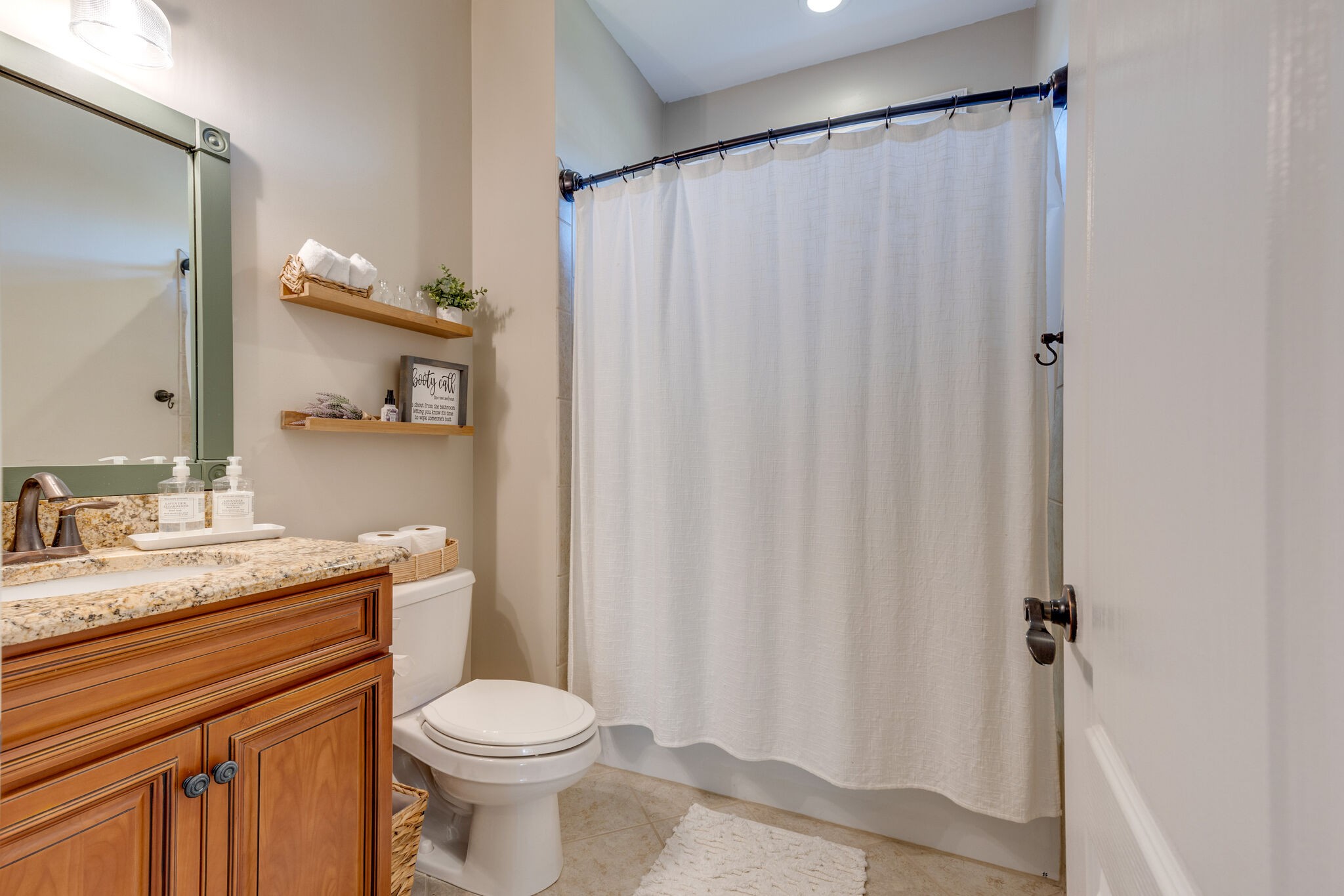 3207 Appian Way Spring Hill, TN 37174 - Photo 26 of 50 a bathroom with a granite countertop toilet sink and mirror