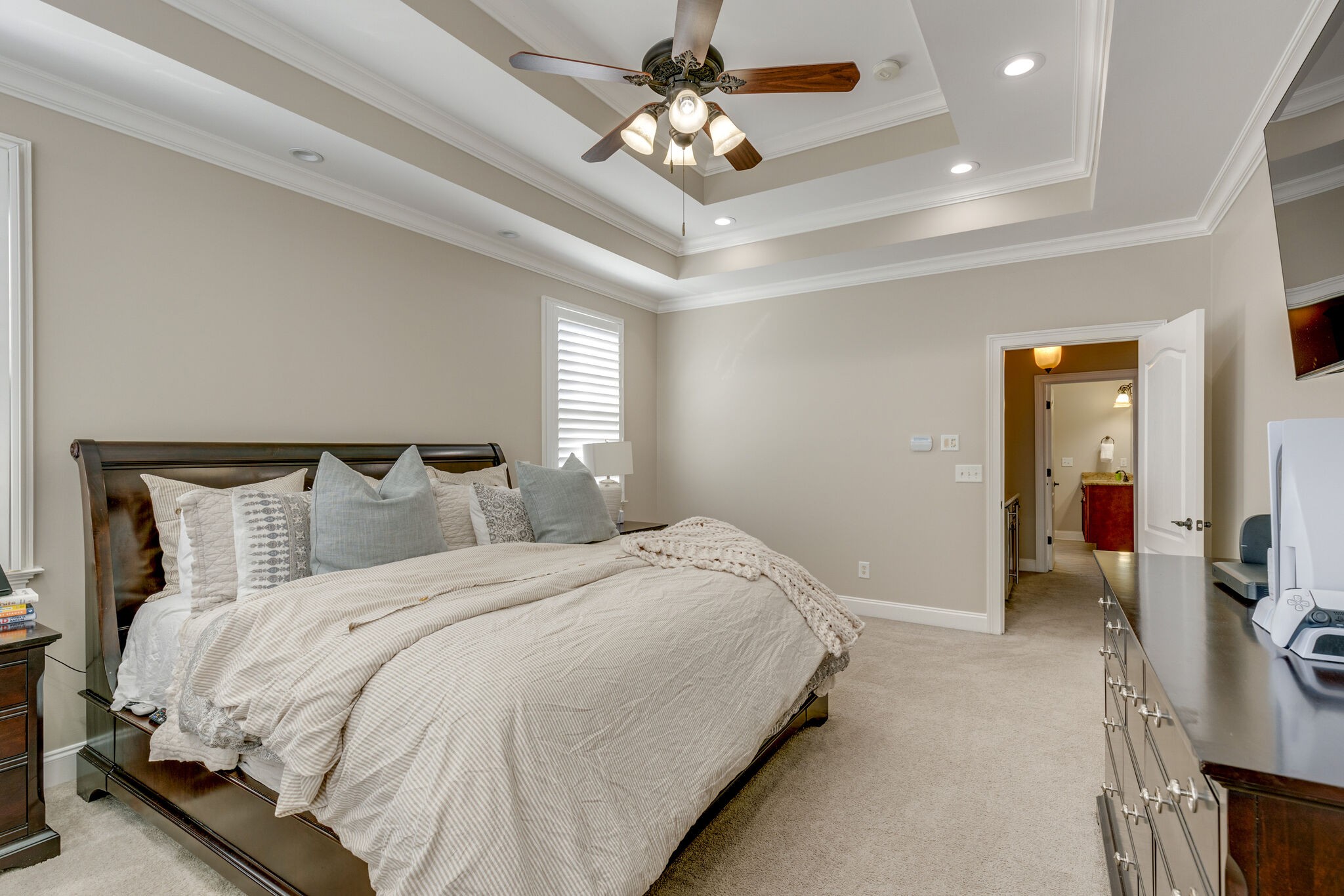 3207 Appian Way Spring Hill, TN 37174 - Photo 28 of 50 a bedroom with bed and a chandelier