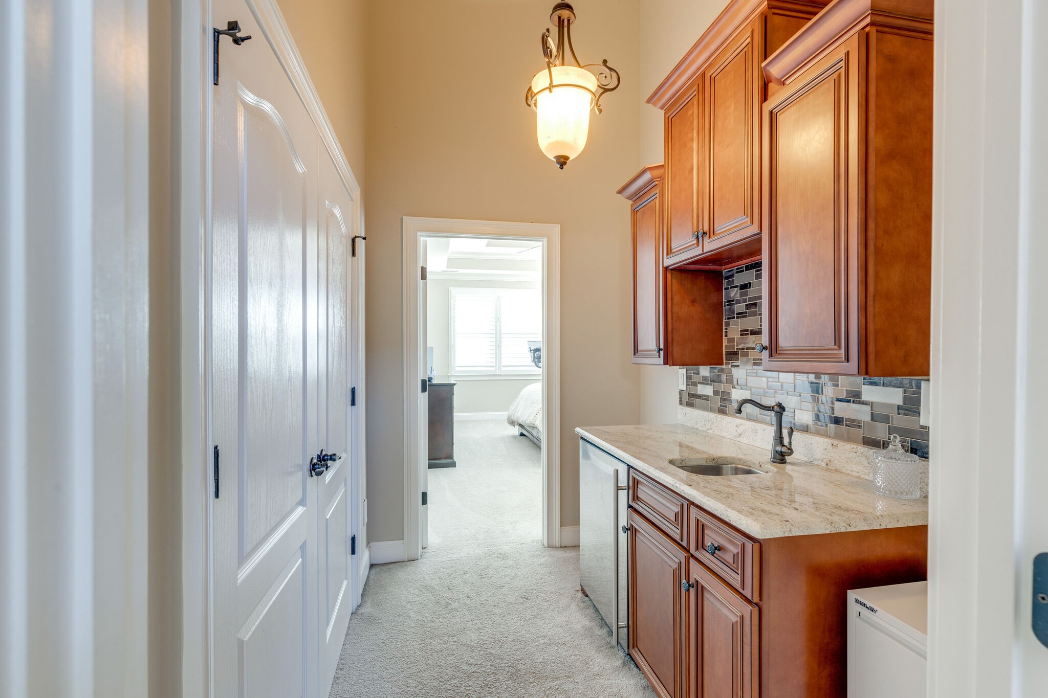 3207 Appian Way Spring Hill, TN 37174 - Photo 29 of 50 a bathroom with a granite countertop sink a mirror and a shower