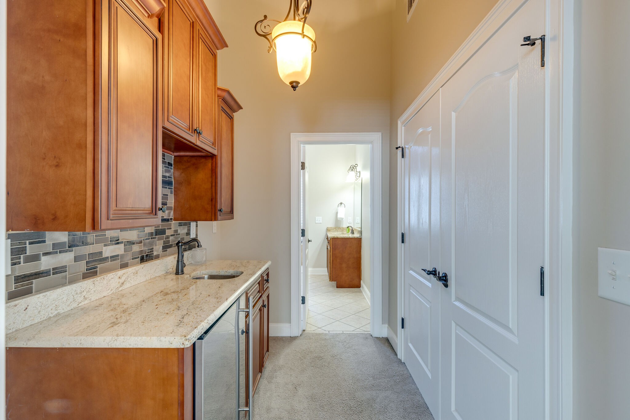 3207 Appian Way Spring Hill, TN 37174 - Photo 30 of 50 a bathroom with a granite countertop sink a mirror and a shower