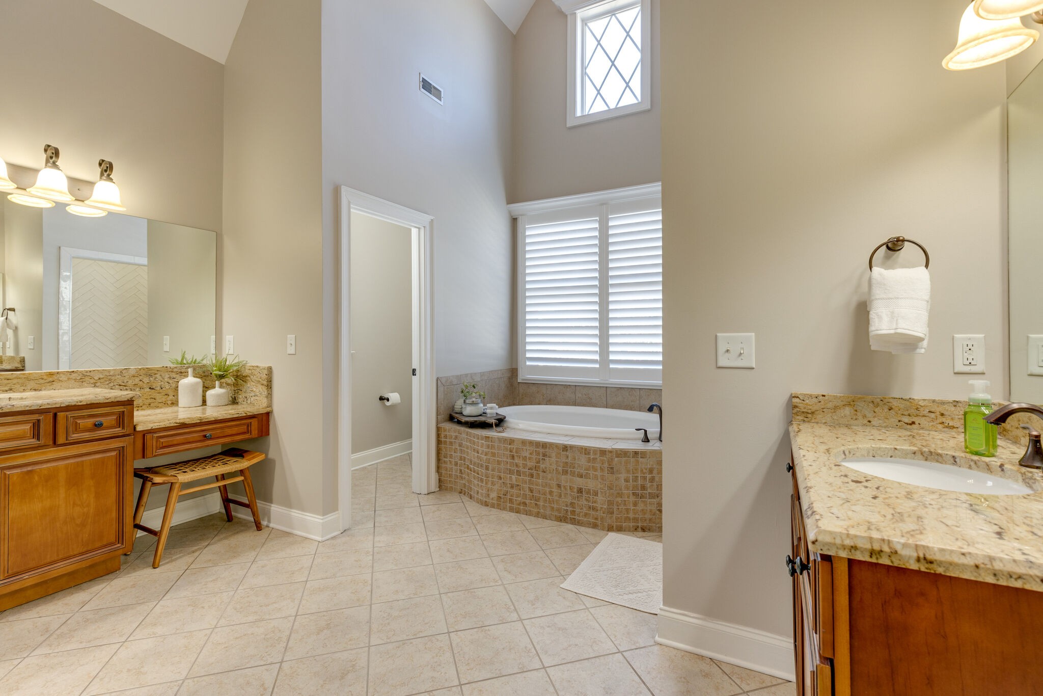 3207 Appian Way Spring Hill, TN 37174 - Photo 31 of 50 a bathroom with a granite countertop sink and a bathtub