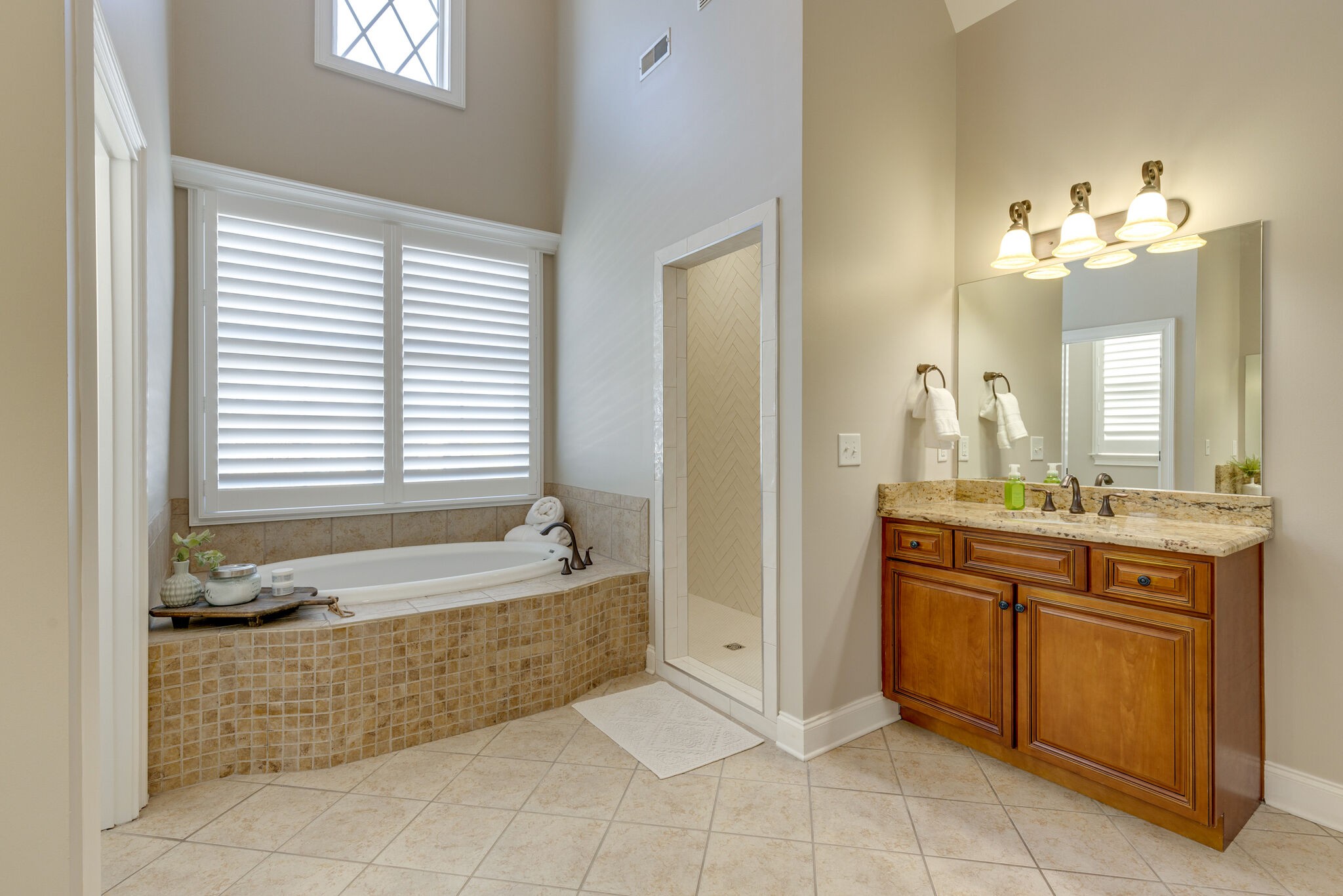 3207 Appian Way Spring Hill, TN 37174 - Photo 32 of 50 a spacious bathroom with a tub sink and mirror