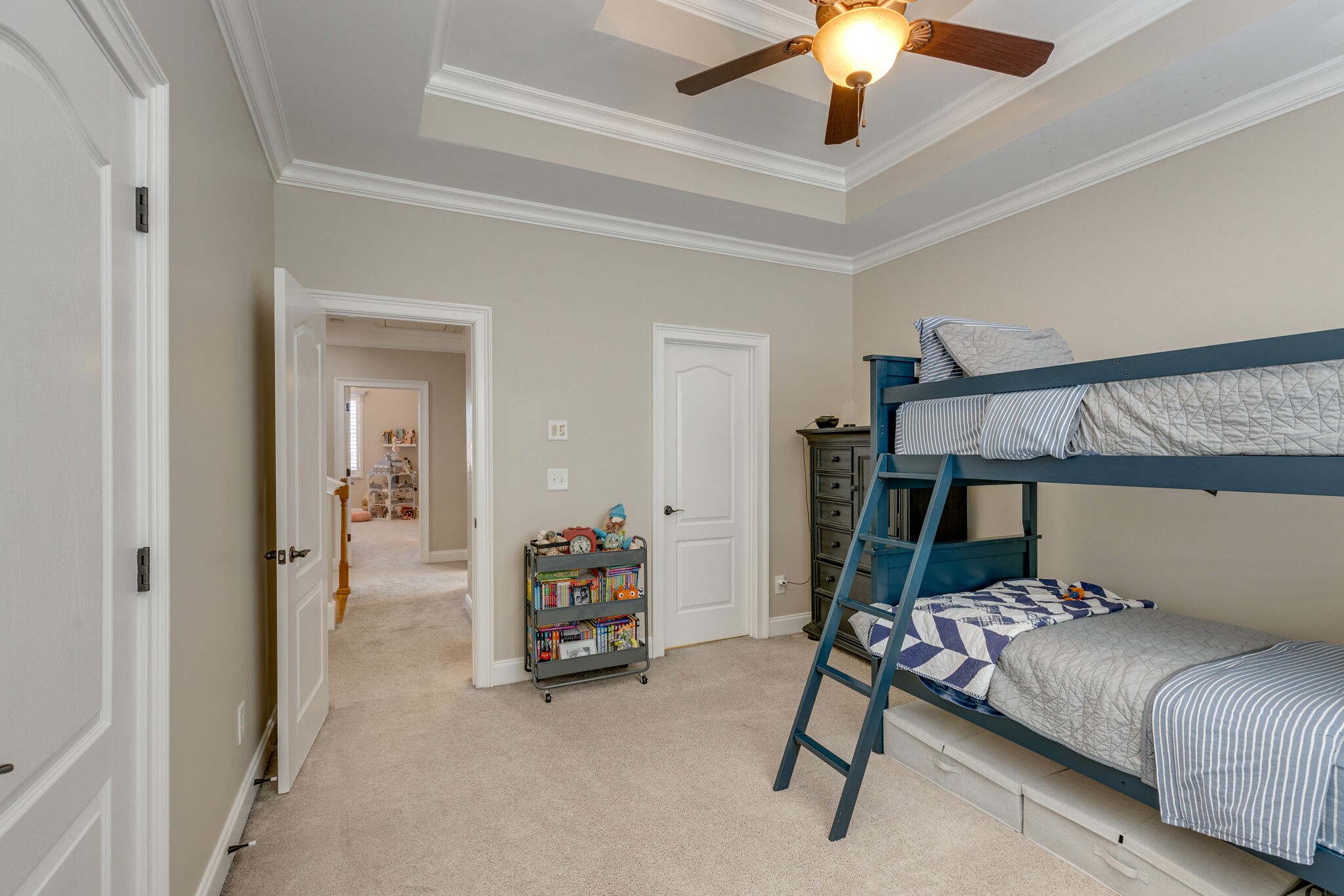 3207 Appian Way Spring Hill, TN 37174 - Photo 37 of 50 a bedroom with furniture and a chandelier fan