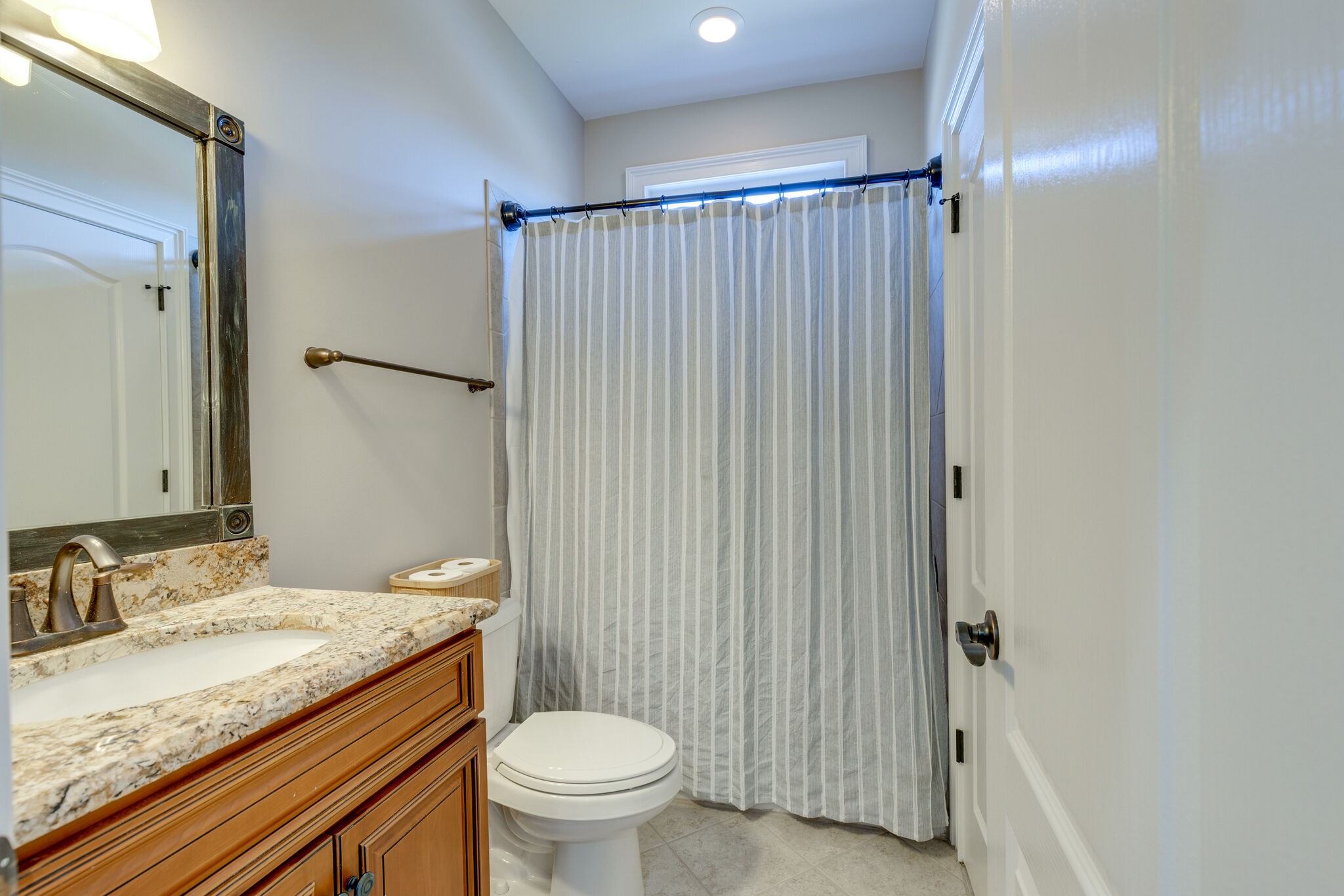 3207 Appian Way Spring Hill, TN 37174 - Photo 38 of 50 a bathroom with a granite countertop sink toilet and shower