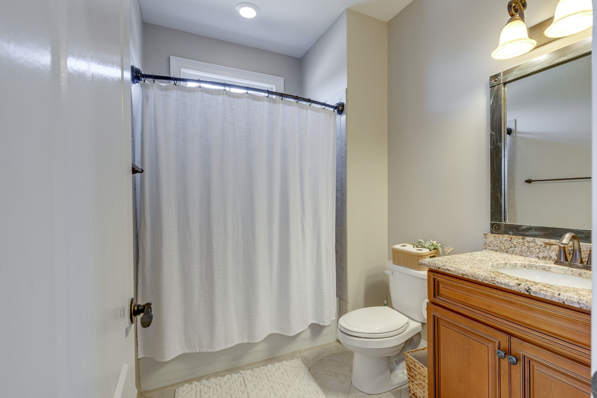 3207 Appian Way Spring Hill, TN 37174 - Photo 42 of 50 a white toilet sitting next to a bathroom sink