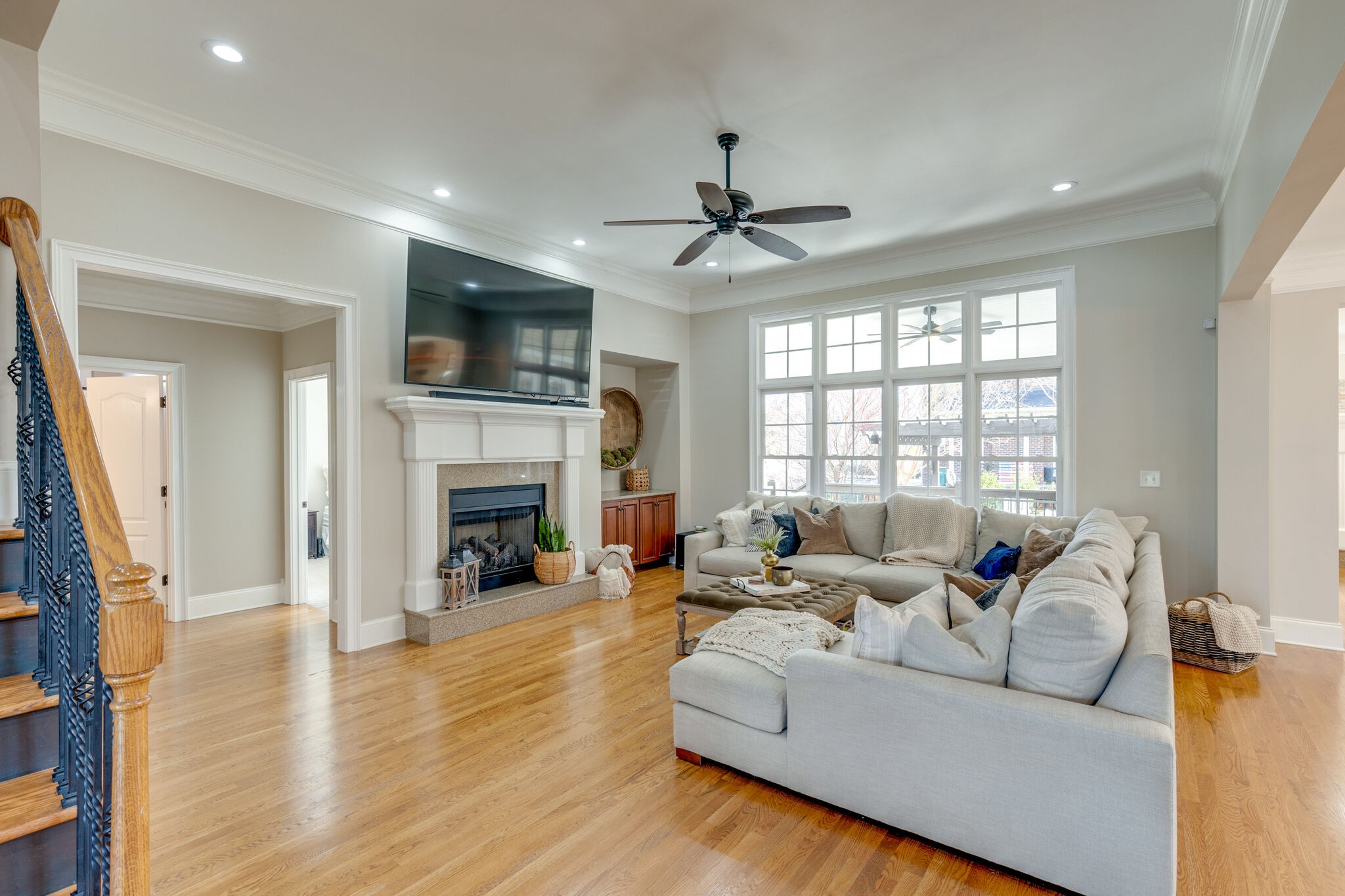 3207 Appian Way Spring Hill, TN 37174 - Photo 9 of 50 a living room with furniture a fireplace and a flat screen tv