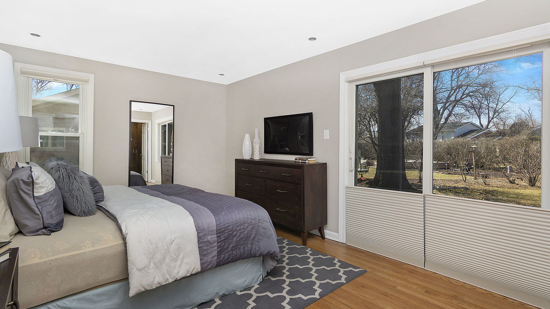 352 Gatesby Road Riverside, IL 60546 - Photo 11 of 18 a bedroom with a bed and glass door
