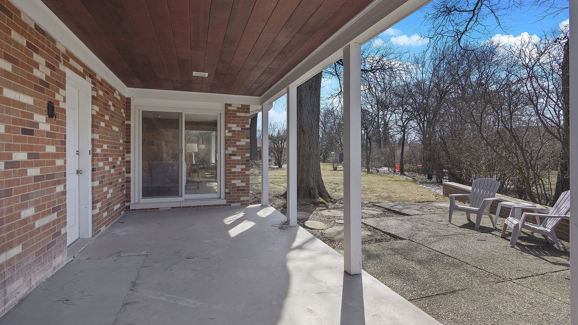 352 Gatesby Road Riverside, IL 60546 - Photo 16 of 18 a view of a patio with table and chairs and floor to ceiling window