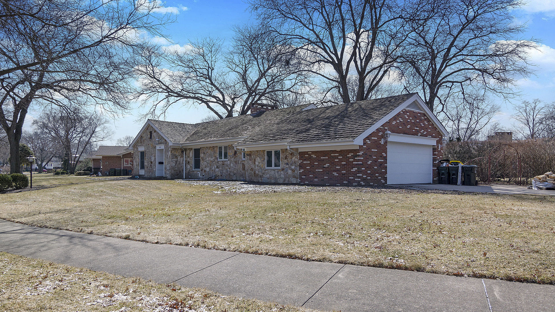 352 Gatesby Road Riverside, IL 60546 - Photo 18 of 18 a front view of a house with a yard and garage