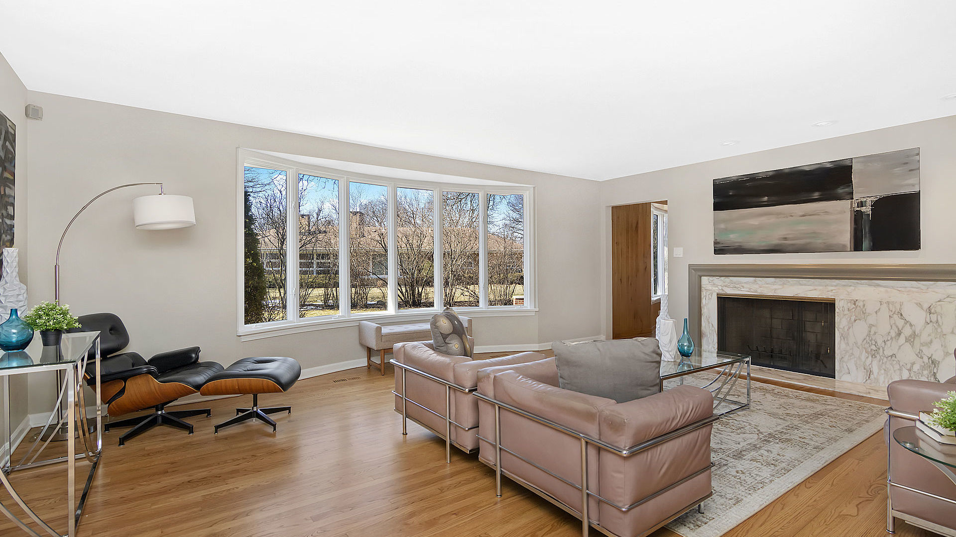 352 Gatesby Road Riverside, IL 60546 - Photo 3 of 18 a living room with furniture a flat screen tv and a fireplace
