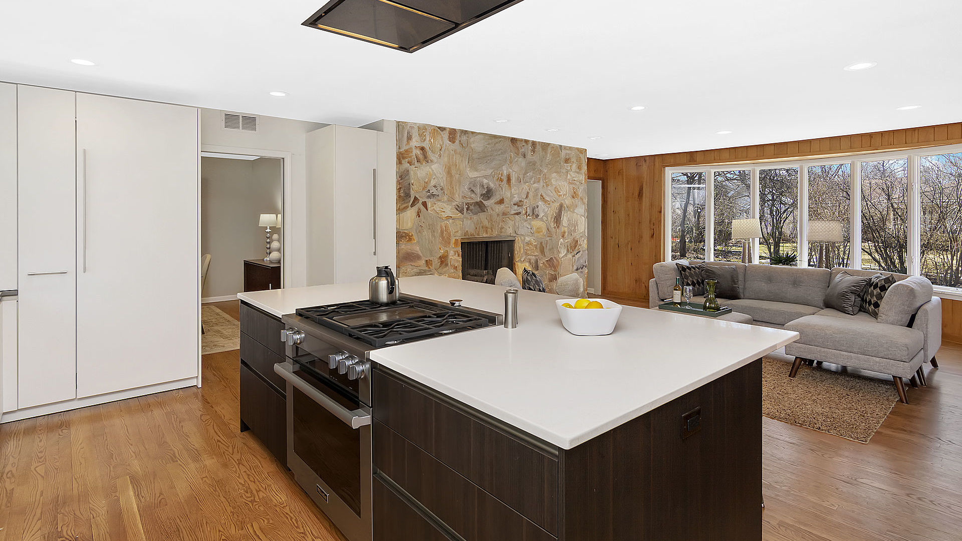 352 Gatesby Road Riverside, IL 60546 - Photo 7 of 18 a kitchen with a stove and a living room