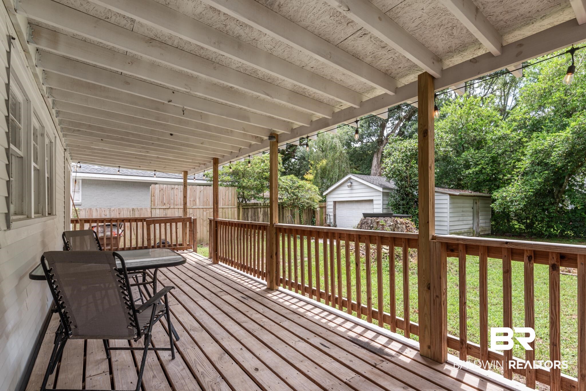 114 Crenshaw Street Mobile, AL 36606 - Photo 45 of 49 Wooden deck with a garage, a yard, and an outdoor structure