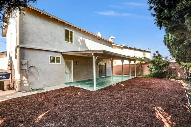 a house with trees in front of it