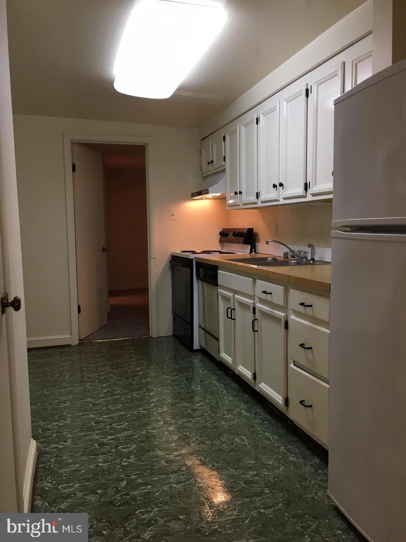 2007 Kalorama Road Northwest Washington, DC 20009 - Photo 7 of 19 Nice. white, galley kitchen