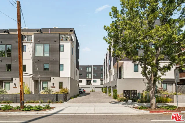 a front view of a building with street view