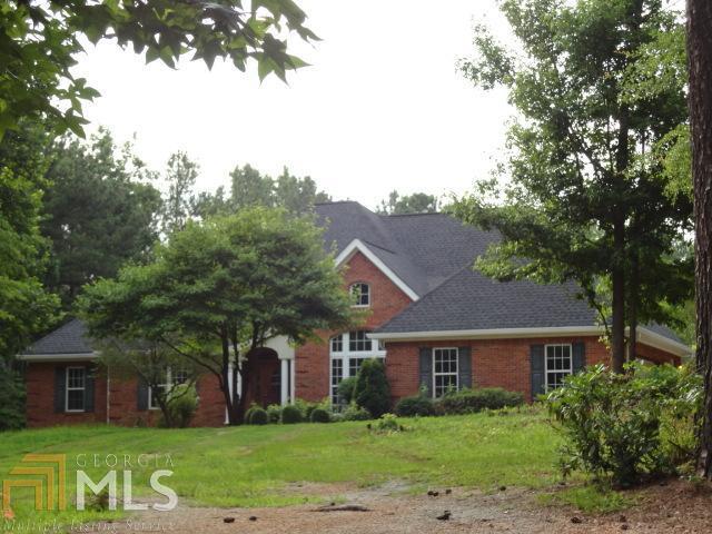 6115 Dodson Road Fairburn, GA 30213 - Photo 1 of 1 a front view of house with yard and green space