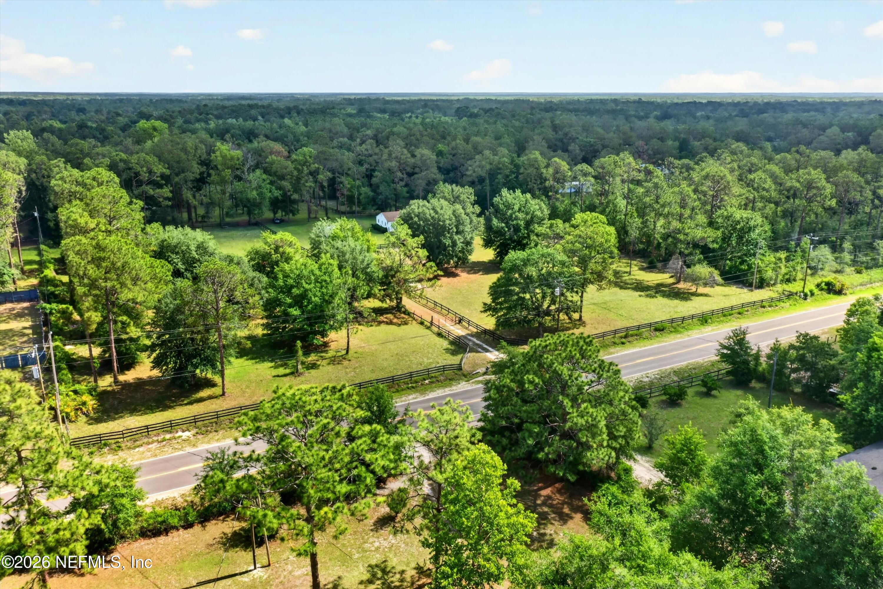 5214 Carter Spencer Road Middleburg, FL 32068 - Photo 43 of 50 an aerial view of residential houses with outdoor space and trees