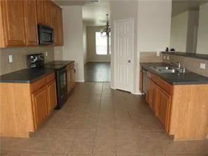 a kitchen that has a sink and a stove