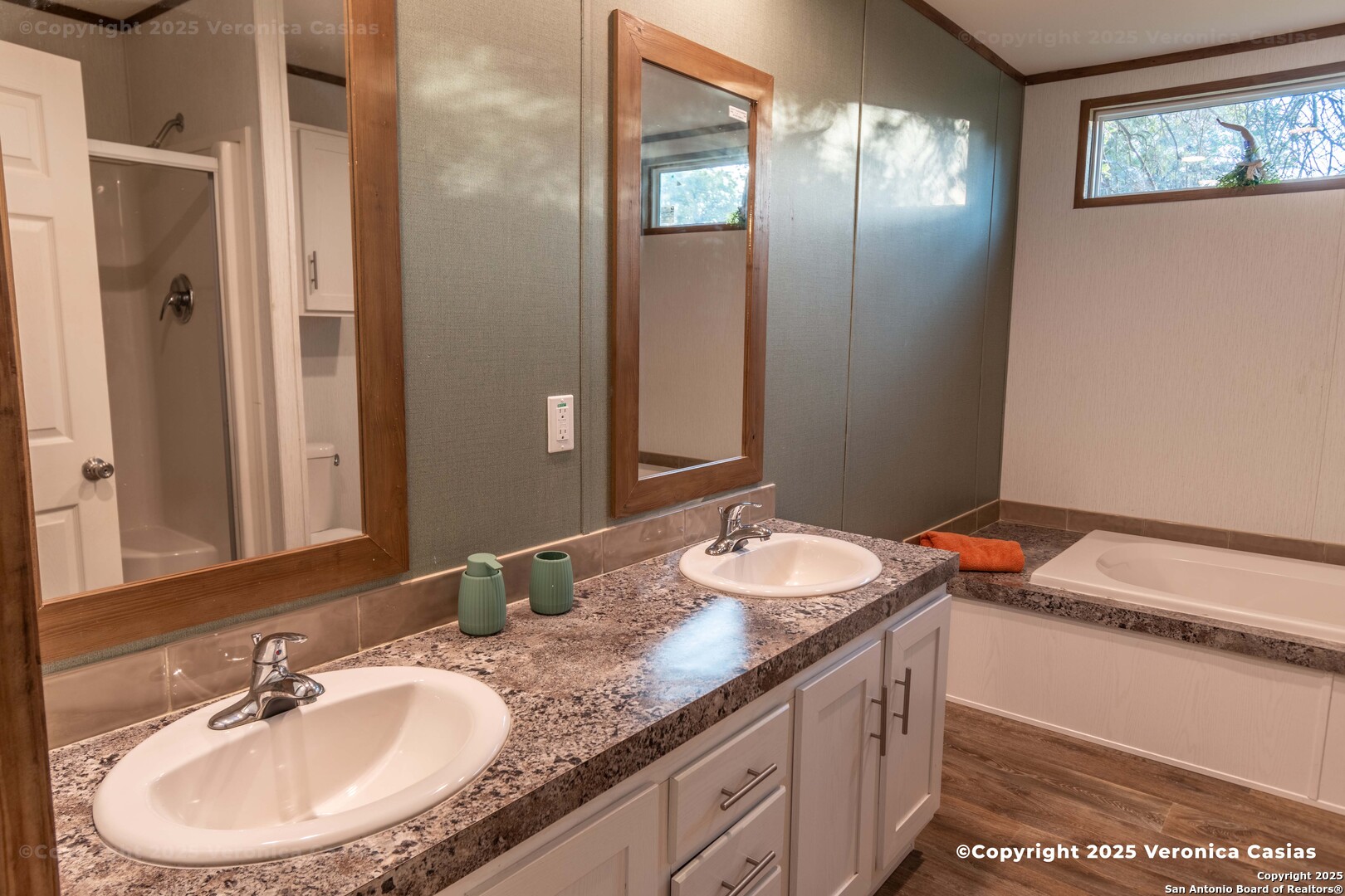 336 County Road 6846 Lytle, TX 78052 - Photo 16 of 20 a bathroom with a granite countertop sink and a mirror