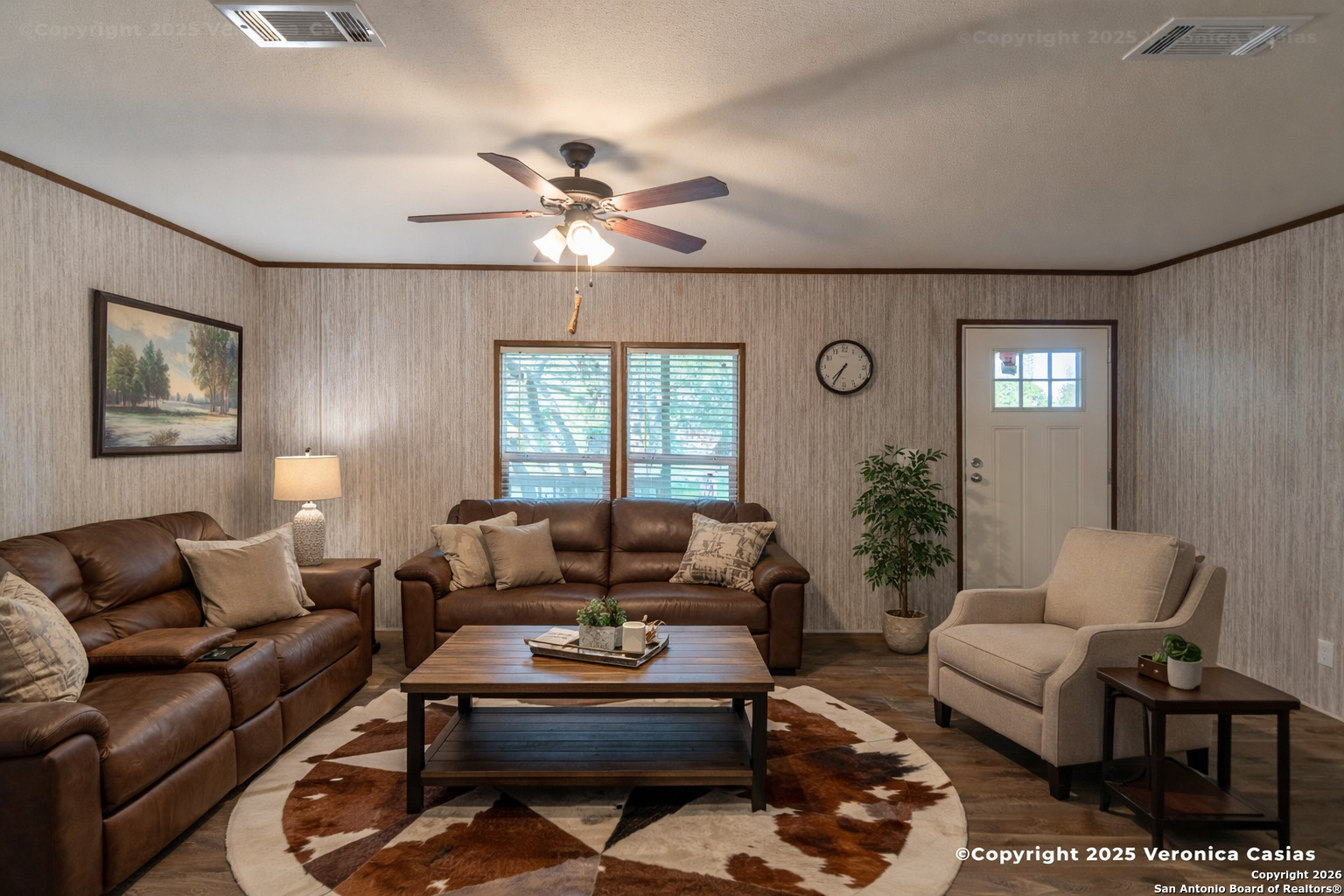 336 County Road 6846 Lytle, TX 78052 - Photo 4 of 20 a living room with furniture ceiling fan and a window