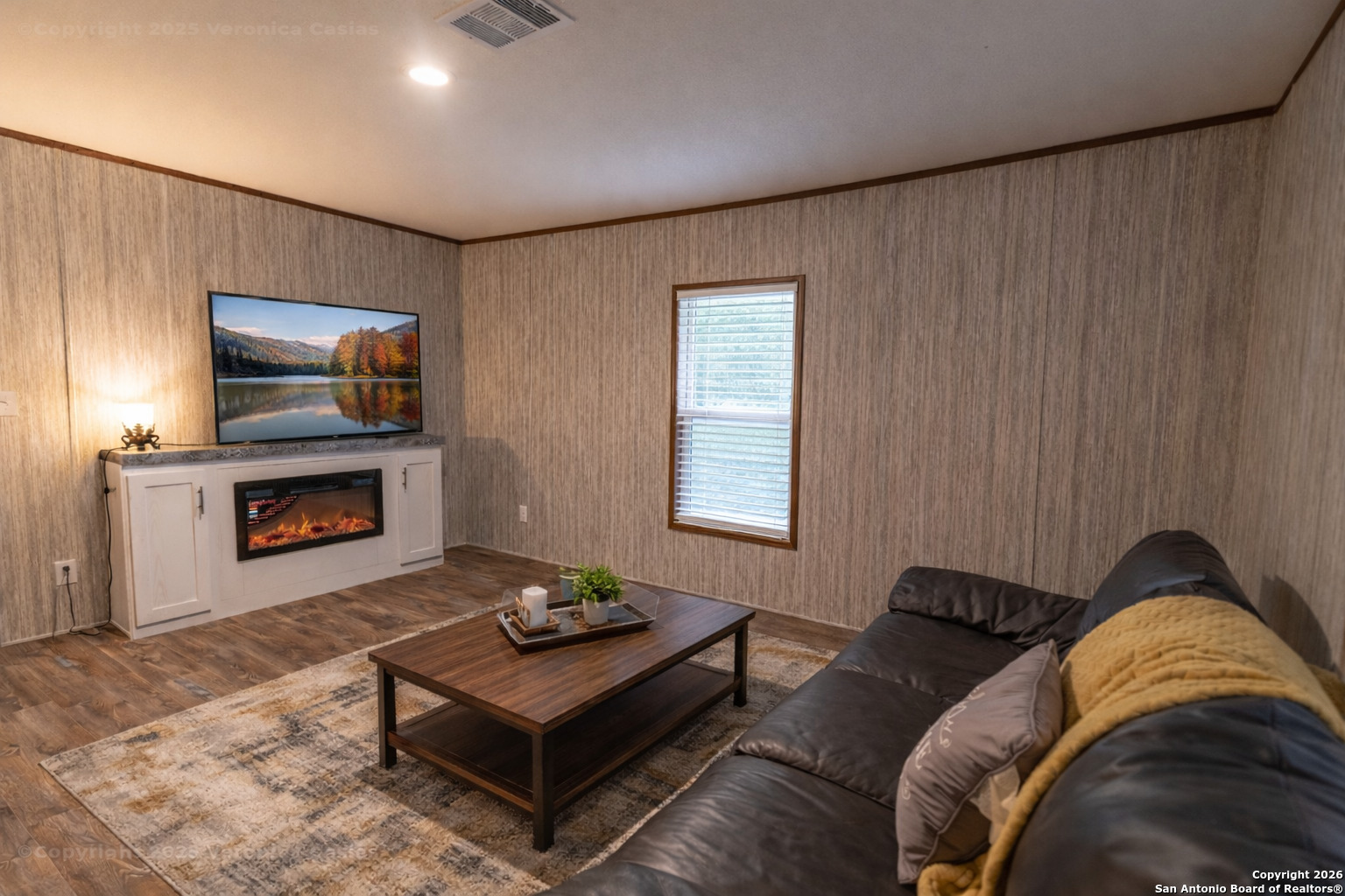 336 County Road 6846 Lytle, TX 78052 - Photo 9 of 20 a living room with furniture and a fireplace