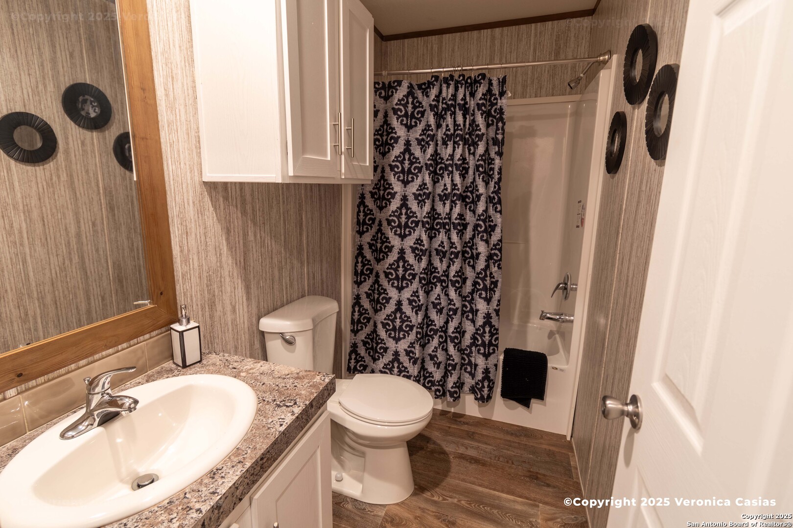 336 County Road 6846 Lytle, TX 78052 - Photo 10 of 20 a bathroom with a sink toilet and shower