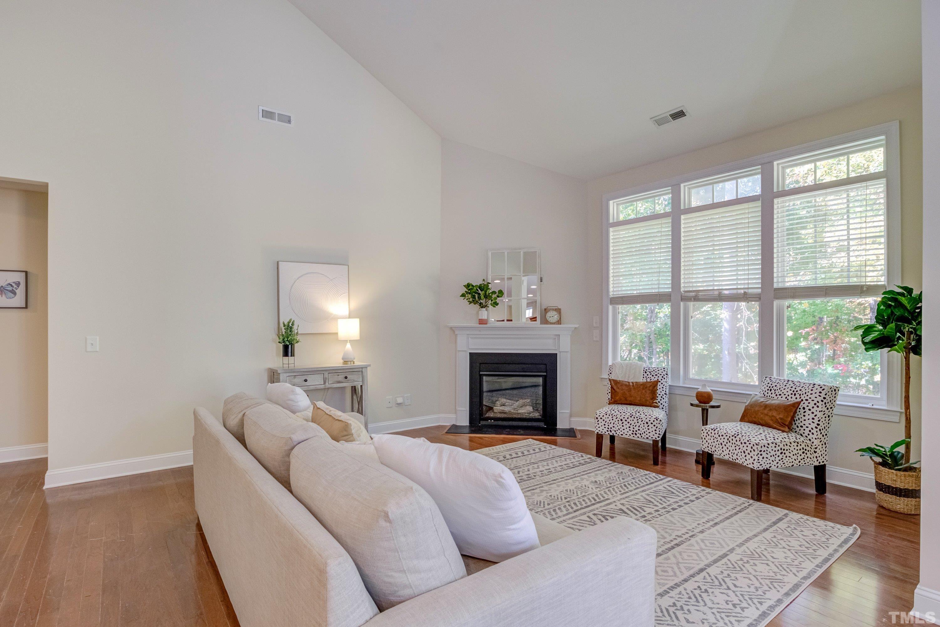 1016 Chapanoke Road Raleigh, NC 27603 - Photo 19 of 49 a living room with furniture and a fireplace