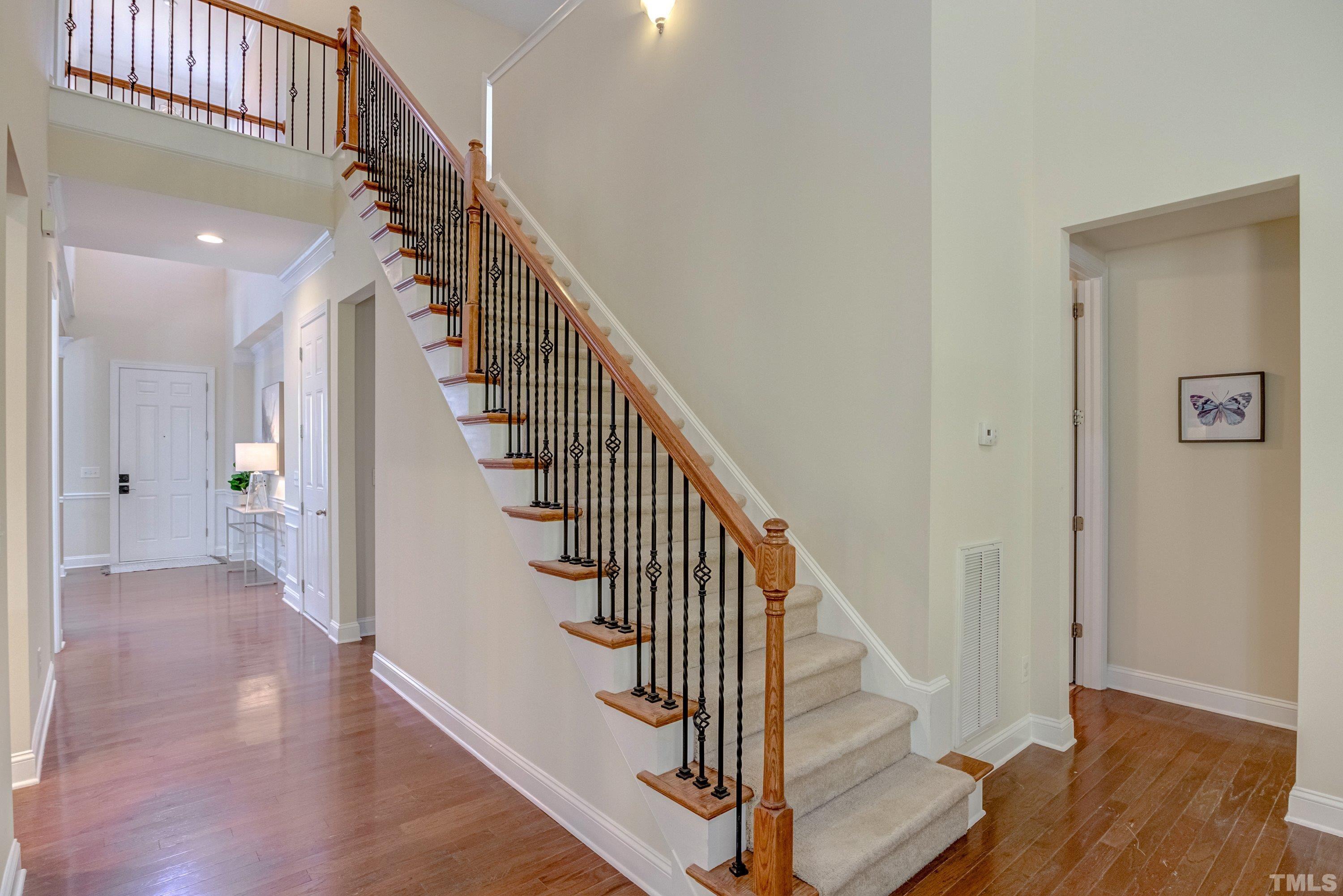 1016 Chapanoke Road Raleigh, NC 27603 - Photo 21 of 49 a view of entryway with wooden floor and stairs