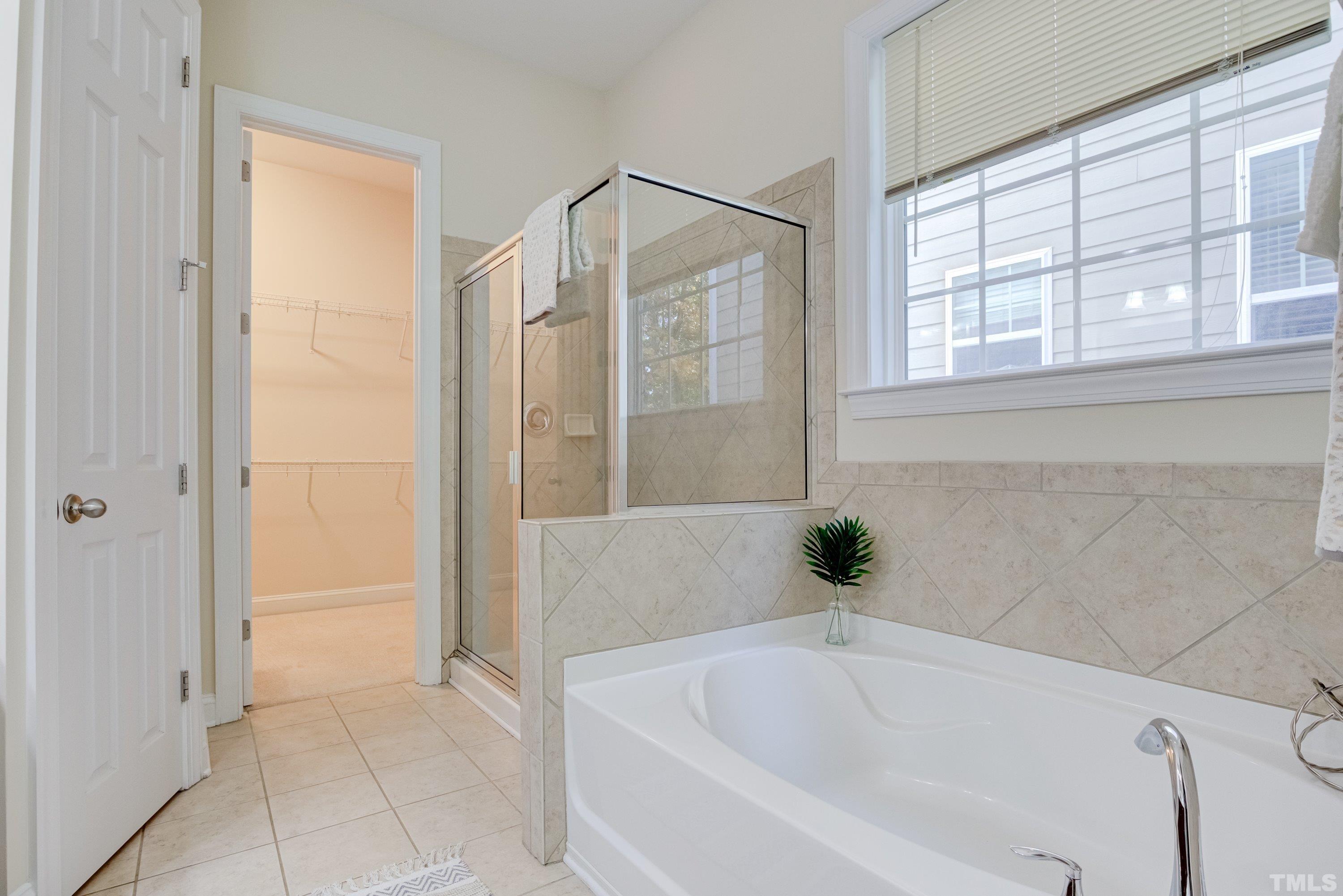1016 Chapanoke Road Raleigh, NC 27603 - Photo 27 of 49 a bathroom with a bathtub and a shower