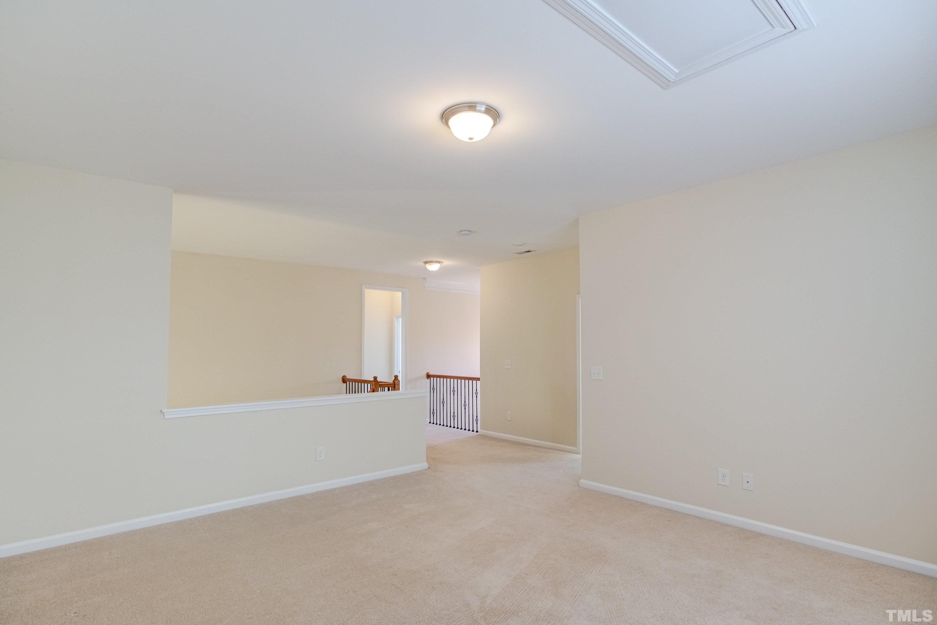 1016 Chapanoke Road Raleigh, NC 27603 - Photo 29 of 49 a view of a big room with wooden floor and windows