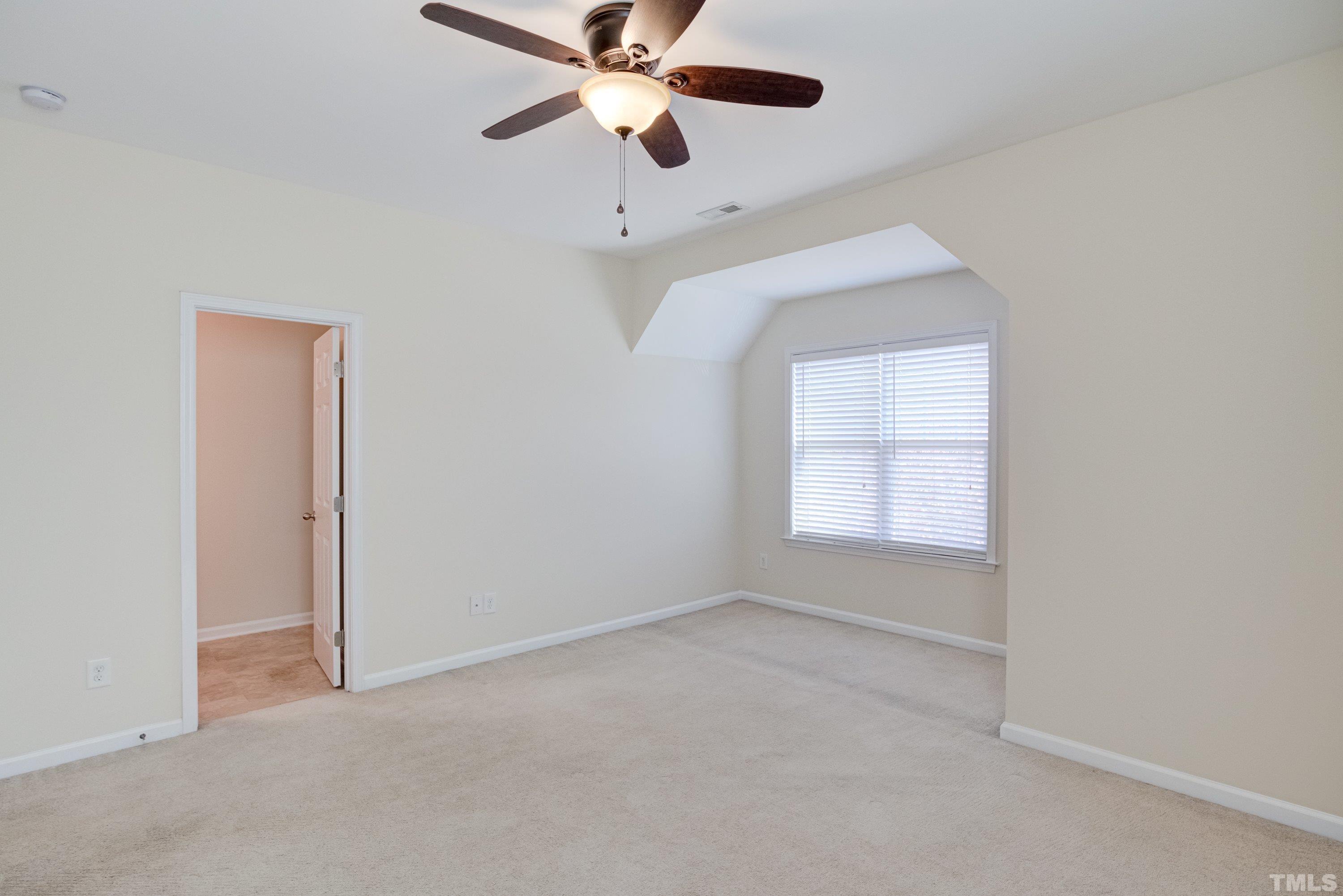 1016 Chapanoke Road Raleigh, NC 27603 - Photo 34 of 49 an empty room with windows and fan