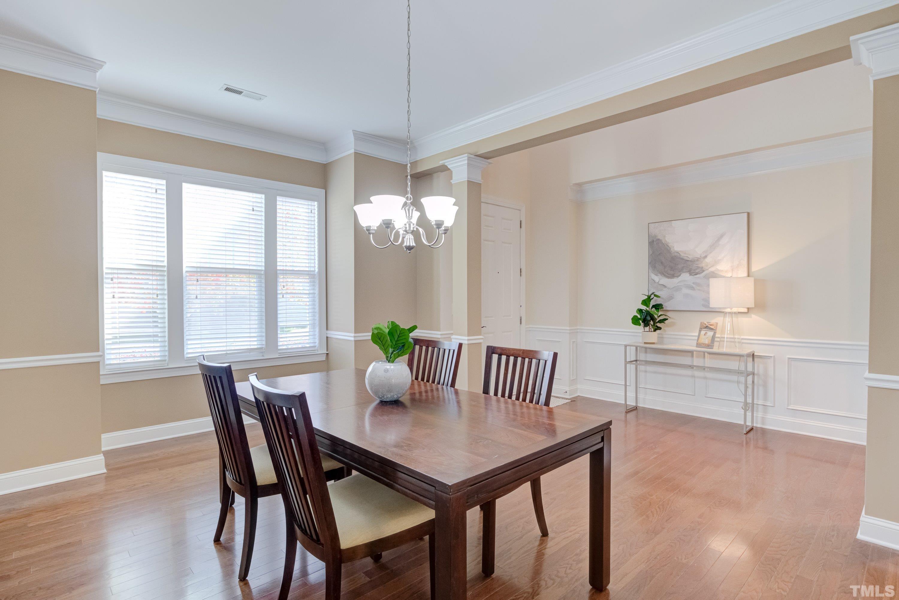 1016 Chapanoke Road Raleigh, NC 27603 - Photo 7 of 49 a view of a dining room with furniture window and wooden floor