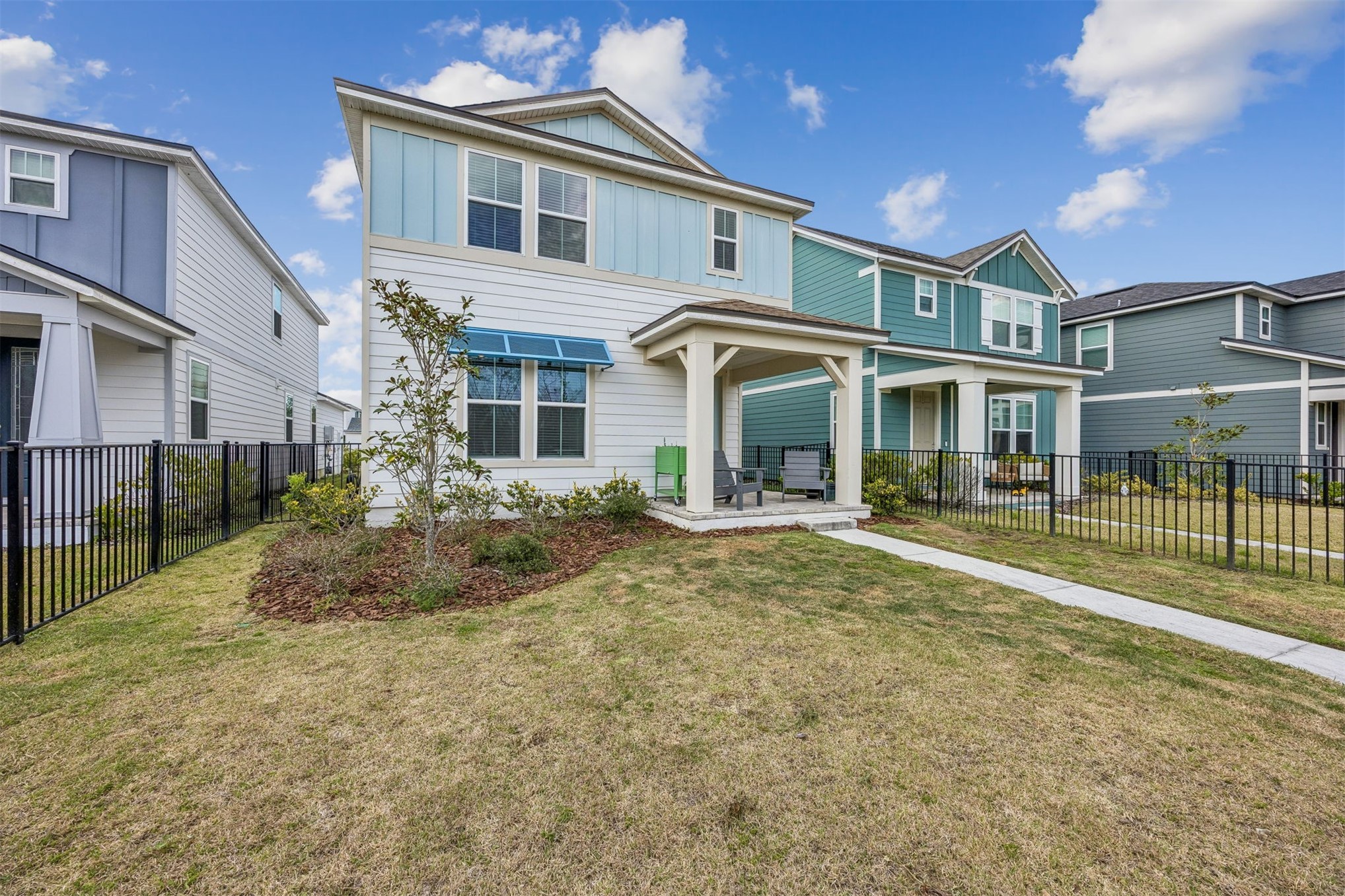 236 Hawthorn Park Circle Yulee, FL 32097 - Photo 3 of 28 a front view of a house with a yard
