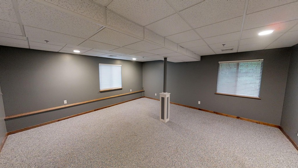 33 Ridgewood Drive, Unit 33 Atkinson, NH 03811 - Photo 13 of 19 a view of an empty room with a window