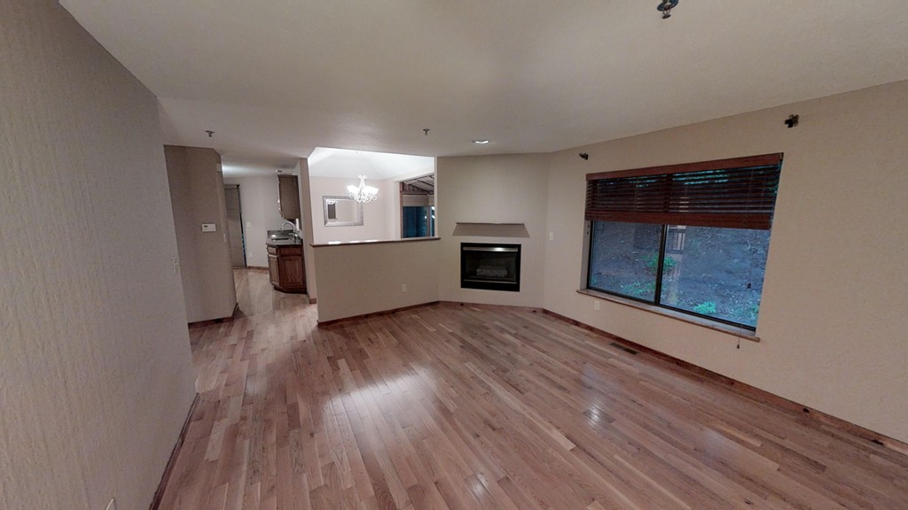 33 Ridgewood Drive, Unit 33 Atkinson, NH 03811 - Photo 6 of 19 a view of a kitchen with wooden floor and a refrigerator
