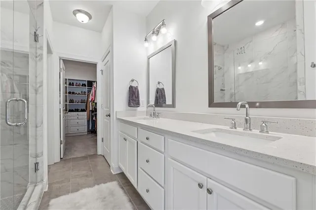 a spacious bathroom with a double vanity sink and a mirror