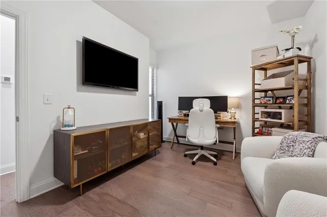 a livingroom with a couch and a flat screen tv