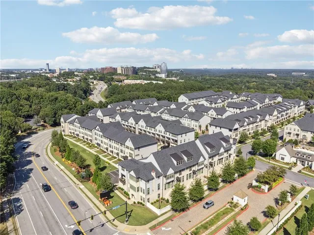 an aerial view of residential houses with outdoor space