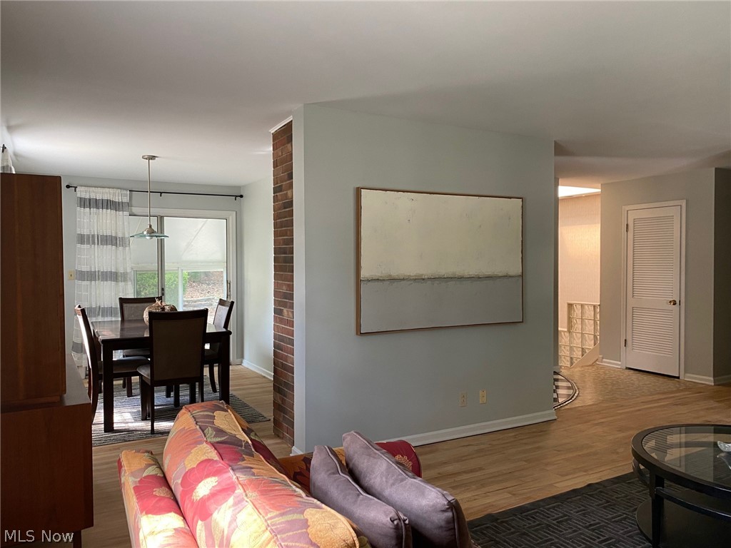 460 Holliston Road Akron, OH 44333 - Photo 3 of 29 Living room looking out to Dining Room and Sun Room