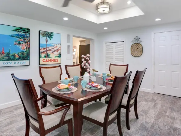 a dining room with furniture and window